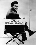 Publicity_photograph_of_Ronald_Reagan_sitting_in_General_Electric_Theater_director's_chair.jpg